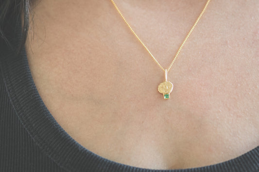 Shown on a 50cm 14k gold chain, 1mm thick rolo chain.